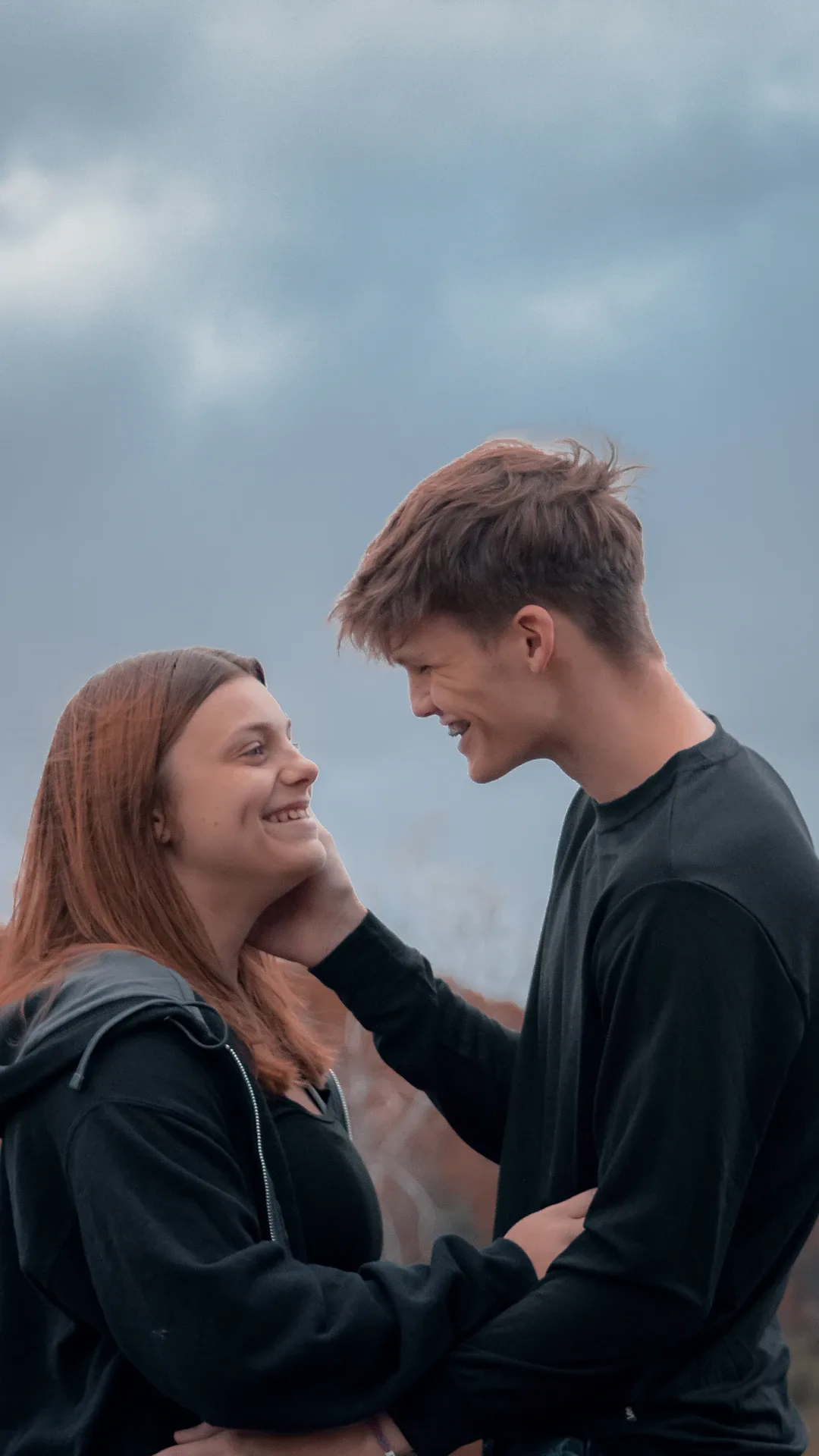 a man and a woman standing next to each other