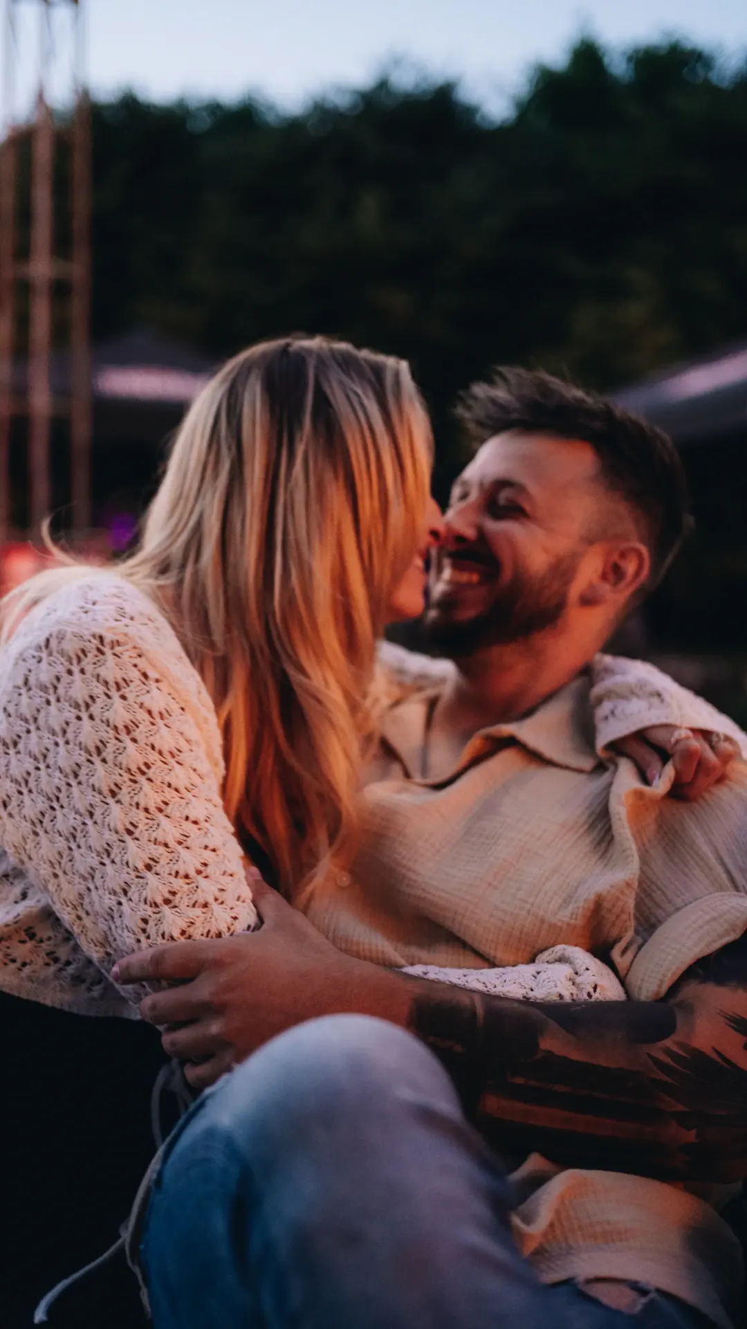 a man and a woman sitting on a bench