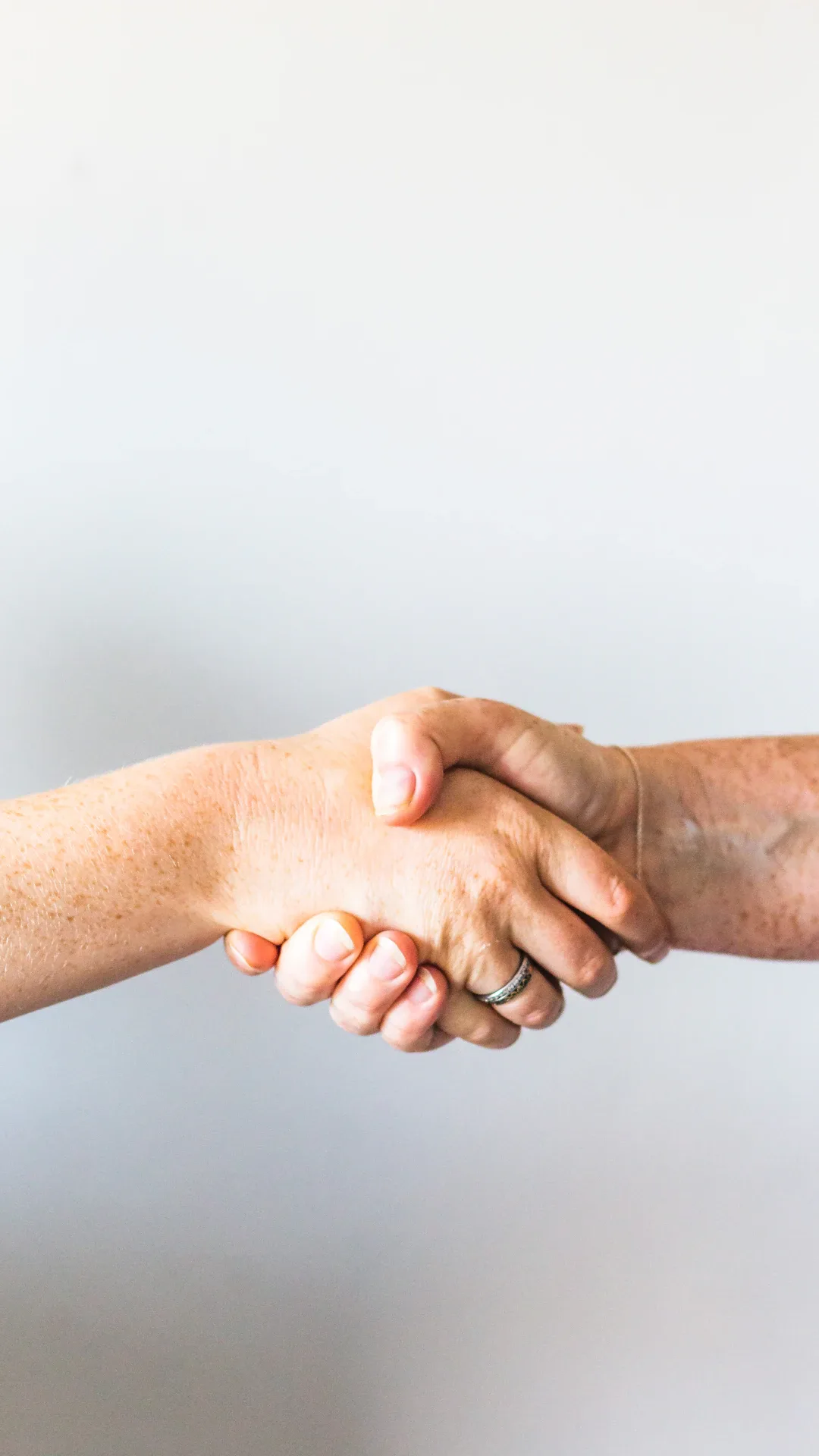 person holding hands of another person