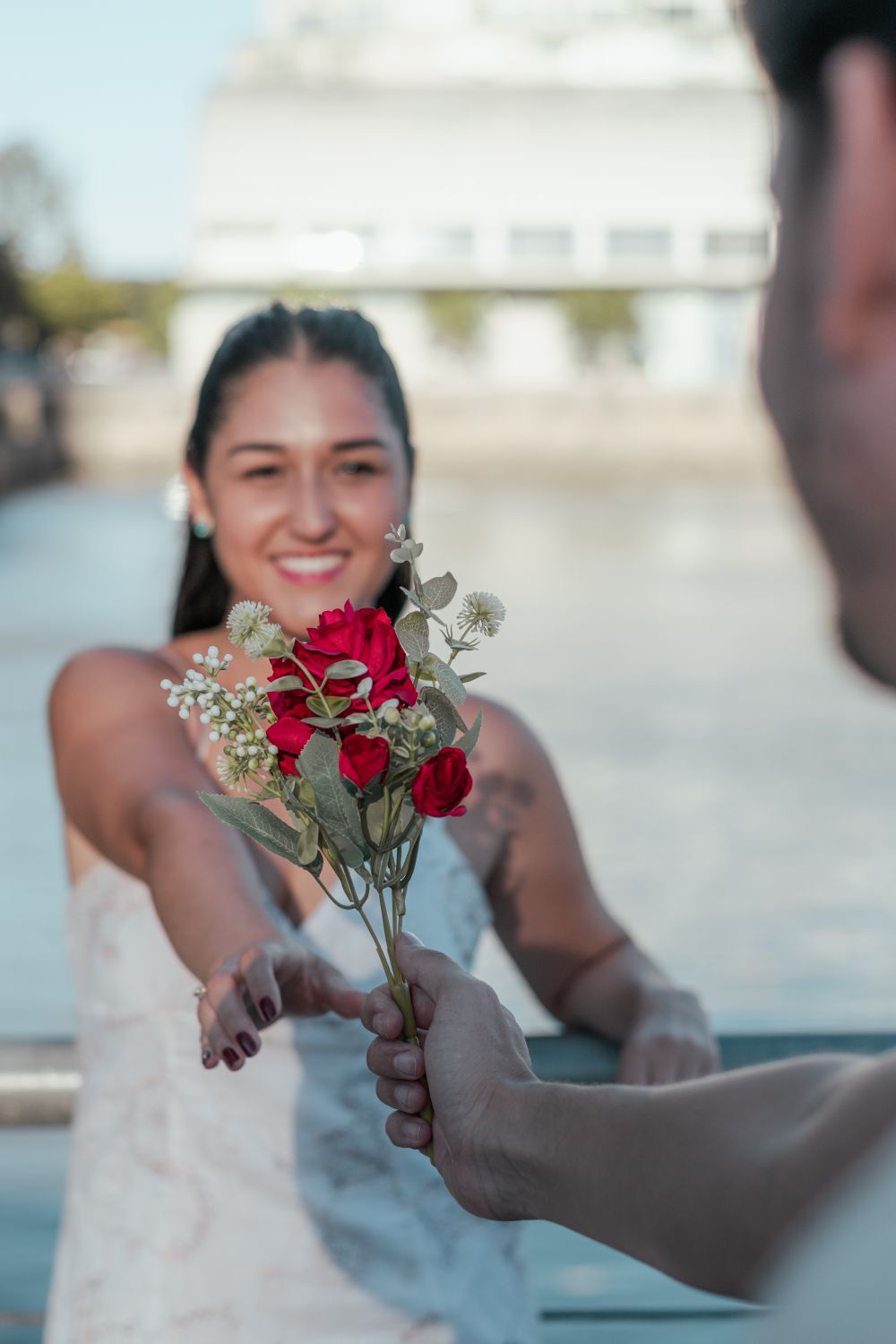 A romantic moment on a sunny day by the river in Buenos Aires.
